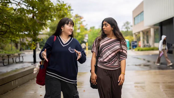 Jacelynn Su, left, and Abeeha Shuja, right, take a stroll at U of T Mississauga 